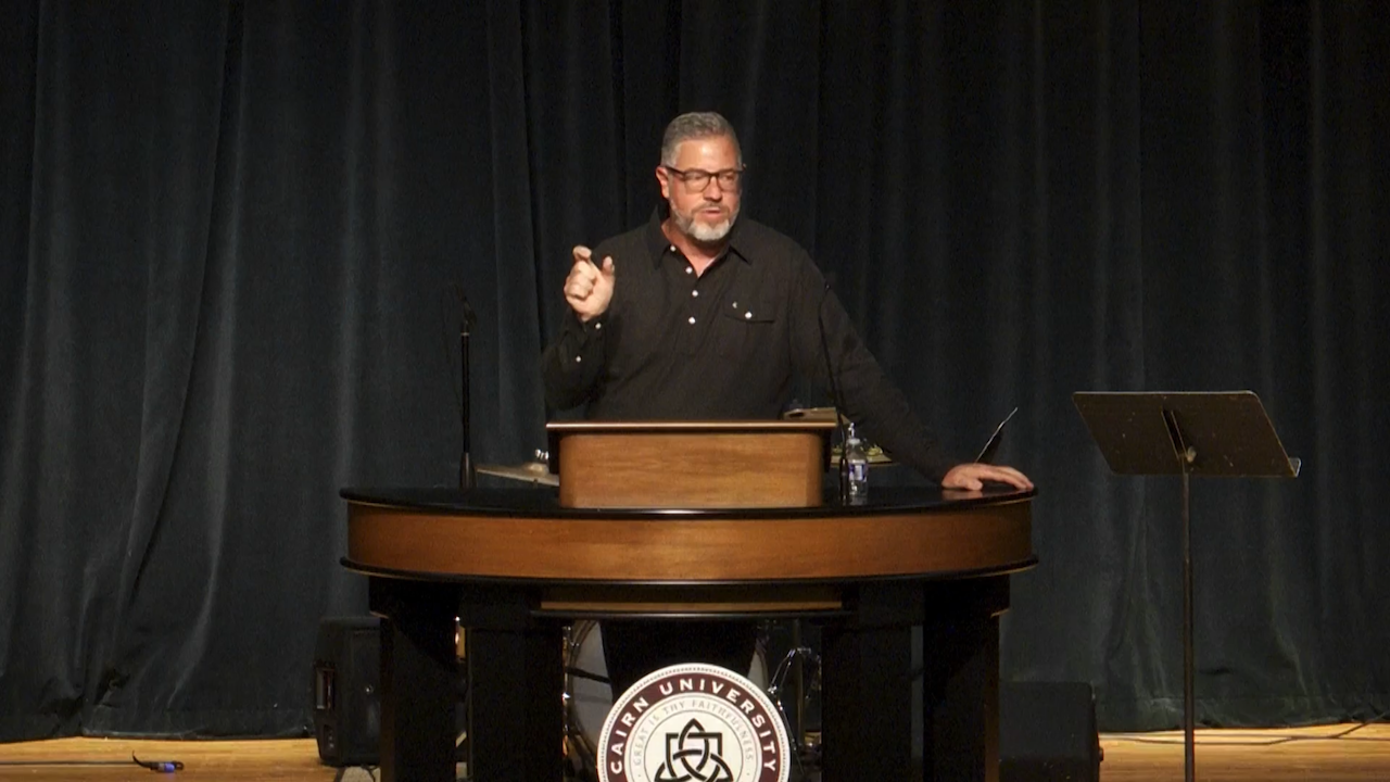 Rob Burns behind chapel podium