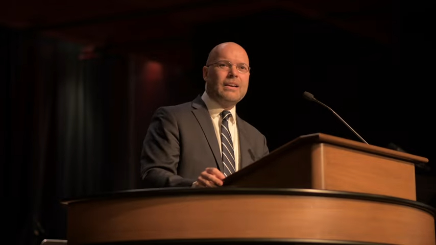 James Dolezal behind chapel podium